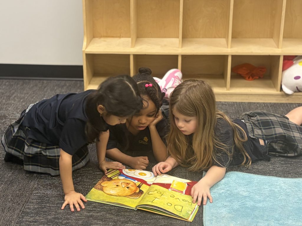 Kindergarten students reading at Fishers Christian Academy